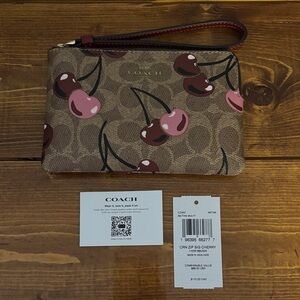 NWT Corner Zip Wristlet in signature cherry